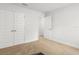 Clean, carpeted bedroom with a closet and a glimpse into an adjacent room at 11042 Heth Ct, Weeki Wachee, FL 34613
