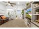 Spacious living room boasts an open floor plan with a view of the front door and dining room at 11042 Heth Ct, Weeki Wachee, FL 34613