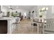 Open-concept living area with wood floors, a dining table, and a view to the Gathering room at 11042 Heth Ct, Weeki Wachee, FL 34613