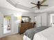 Large main bedroom boasts an ensuite bathroom, a walk-out patio, and a trey ceiling at 11042 Heth Ct, Weeki Wachee, FL 34613