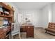 Another angle of the Office with large desk and chair and doorway that shows the dining room beyond at 11042 Heth Ct, Weeki Wachee, FL 34613