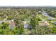 Aerial view of the home and the lush, green neighborhood provides privacy and space at 11340 Corinthian St, Spring Hill, FL 34609
