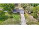 Aerial view of a house, highlighting its front yard and access to a driveway at 11340 Corinthian St, Spring Hill, FL 34609