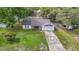 An aerial view of a cute home from above, complete with yard and surroundings at 11340 Corinthian St, Spring Hill, FL 34609