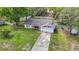 An aerial shot of a cute one-story home, showcasing its yard and attached garage at 11340 Corinthian St, Spring Hill, FL 34609