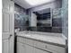 Bathroom showcasing a granite countertop vanity, decorative tile, and modern fixtures at 11340 Corinthian St, Spring Hill, FL 34609