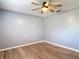 This bedroom features laminate flooring and overhead lighting at 11340 Corinthian St, Spring Hill, FL 34609