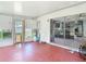 View of Enclosed Porch showing access to the Interior, the yard and a doggie door at 11340 Corinthian St, Spring Hill, FL 34609