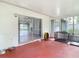 View of the Enclosed Porch with access to the home's Interior and yard at 11340 Corinthian St, Spring Hill, FL 34609