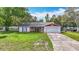 Charming single-story home featuring a well-maintained lawn and an attached two-car garage at 11340 Corinthian St, Spring Hill, FL 34609