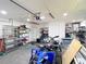 This garage features ATV vehicles and metal shelving at 11340 Corinthian St, Spring Hill, FL 34609