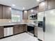 Updated kitchen with stainless steel appliances and granite countertops at 11340 Corinthian St, Spring Hill, FL 34609