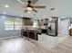 Fully equipped kitchen with stainless steel appliances, granite countertops, and a convenient island, perfect for cooking at 11340 Corinthian St, Spring Hill, FL 34609