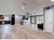 Open-concept living room with kitchen and living area at 11340 Corinthian St, Spring Hill, FL 34609