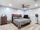 Comfortable bedroom featuring a ceiling fan, ample natural light, and space for a desk and dresser at 11340 Corinthian St, Spring Hill, FL 34609
