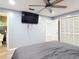 Relaxing bedroom featuring an ensuite bathroom, offering convenience and privacy, complete with modern fixtures at 11340 Corinthian St, Spring Hill, FL 34609