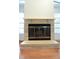 Close-up of a stone fireplace with glass doors and a mantle at 11364 Orangewood Ct, Spring Hill, FL 34609