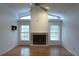 Spacious living room featuring a fireplace with large windows and vaulted ceilings at 11364 Orangewood Ct, Spring Hill, FL 34609