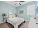 Light and airy bedroom with soft blue walls and a calming ambiance at 11579 Weaver Hollow Rd, New Port Richey, FL 34654