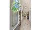 Inviting entryway with decorative glass front door, tile flooring, and a view into the dining and living spaces at 11579 Weaver Hollow Rd, New Port Richey, FL 34654