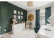 Cozy office area with dark green accent wall, desk, storage, and modern decor at 11579 Weaver Hollow Rd, New Port Richey, FL 34654