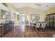 Inviting entryway featuring high ceilings, modern light fixture, and hardwood flooring at 11637 Spindrift Loop, Hudson, FL 34667
