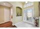 Stylish foyer featuring tile flooring, decorative niches, and an arched entry to the main living area at 11637 Spindrift Loop, Hudson, FL 34667