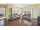 Bright living room showcasing hardwood floors, neutral paint, and views to the outside at 11637 Spindrift Loop, Hudson, FL 34667