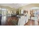 Open concept design seamlessly connects the living room, dining area, and kitchen at 11637 Spindrift Loop, Hudson, FL 34667