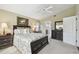 Spacious main bedroom with a ceiling fan, and an ensuite bathroom at 11637 Spindrift Loop, Hudson, FL 34667