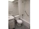 A clean bathroom featuring a shower-tub combo, a functional toilet, and a vanity sink with a mirror at 11715 Boynton Ln # 74B, New Port Richey, FL 34654