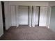 Bedroom with closet space and access to other rooms in the house at 11715 Boynton Ln # 74B, New Port Richey, FL 34654