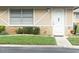Charming single-story home with a well-maintained lawn, stone accents, and a welcoming white front door at 11715 Boynton Ln # 74B, New Port Richey, FL 34654