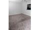 Bright living room offers a pass-through window to the kitchen and ample space at 11715 Boynton Ln # 74B, New Port Richey, FL 34654