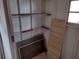 Ample storage in a utility room with shelves at 11715 Boynton Ln # 74B, New Port Richey, FL 34654