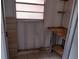 Functional utility room with a window and built-in table at 11715 Boynton Ln # 74B, New Port Richey, FL 34654