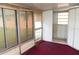 Enclosed sun room with windows and doors, offering extra living space at 11715 Boynton Ln # 74B, New Port Richey, FL 34654
