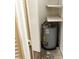 A water heater is located in a closet with shelving for storage at 11715 Boynton Ln # 74B, New Port Richey, FL 34654