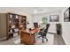 Spacious office features wood flooring and a stylish built-in bookcase at 12064 Cradock St, Spring Hill, FL 34608