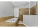 Elegant bathroom features a soaking tub and separate tiled shower with a glass door at 1236 Ketzal Dr, Trinity, FL 34655
