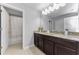 Beautiful bathroom with dual sinks, granite countertop, and tile flooring at 1236 Ketzal Dr, Trinity, FL 34655