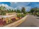 Entrance to the Trinity East neighborhood, featuring lush landscaping at 1236 Ketzal Dr, Trinity, FL 34655