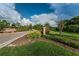 Entrance to the Trinity East community features stone signage and greenery at 1236 Ketzal Dr, Trinity, FL 34655