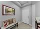 Inviting foyer with neutral tones and a decorative bench and artwork at 1236 Ketzal Dr, Trinity, FL 34655
