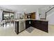 Kitchen with center island, stainless steel dishwasher, and adjacent dining area at 1236 Ketzal Dr, Trinity, FL 34655