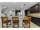 Spacious open kitchen with granite countertops and dark cabinetry at 1236 Ketzal Dr, Trinity, FL 34655