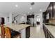 Bright kitchen features granite countertops, stainless steel appliances, and tile flooring at 1236 Ketzal Dr, Trinity, FL 34655