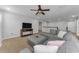 Comfortable living room with plush sectional sofa and ceiling fan at 1236 Ketzal Dr, Trinity, FL 34655
