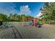 Modern playground with slides, climbers, and a dome, enclosed by a black fence at 1236 Ketzal Dr, Trinity, FL 34655