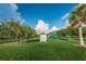 Community playground features a modern jungle gym and shady trees at 1236 Ketzal Dr, Trinity, FL 34655